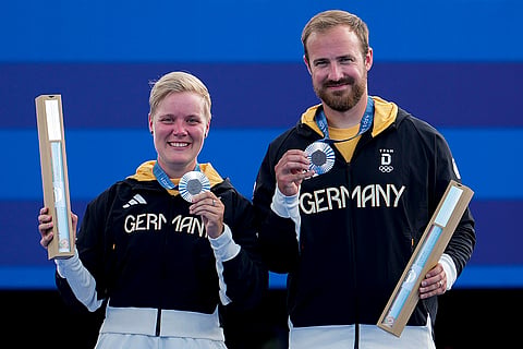 Archery mixed team medal ceremony: Silver medallists Michelle Kroppen and Florian Unruh of Germany